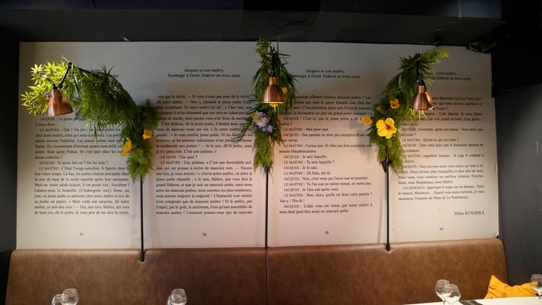 Flowers permanently hang on an extract from Milan Kundera's theater...