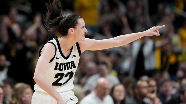 Iowa guard Caitlin Clark (22) reacts after hitting a three-point...
