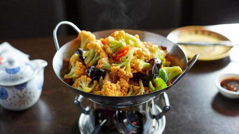 Spicy dry stir-fried cauliflower uses a delicate variety of the vegetable.