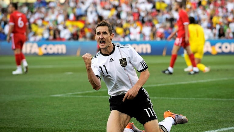 Miroslav Klose of Germany celebrates scoring the opening goal against...