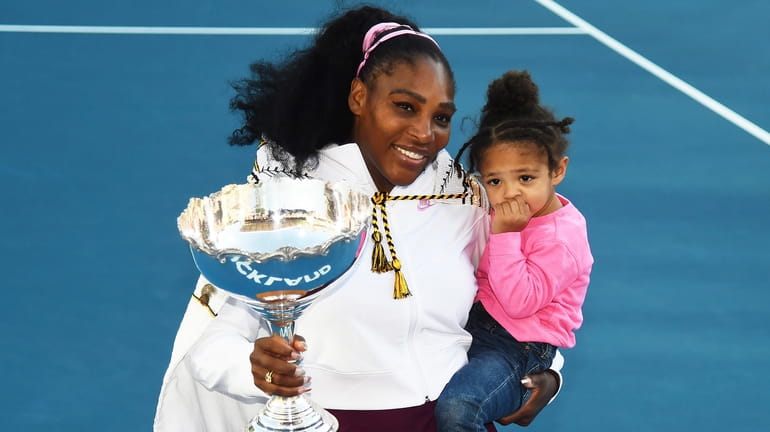 Serena Williams holds her daughter Alexis Olympia Ohanian Jr., and...