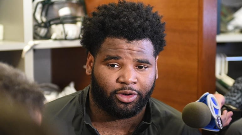 New York Jets defensive end Sheldon Richardson answers questions from...