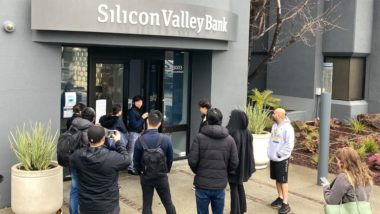 People waiting outside the failed Silicon Valley Bank in Santa Clara,...