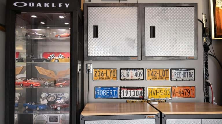 Auto-themed displays in Robert Roth's garage in Manorville.