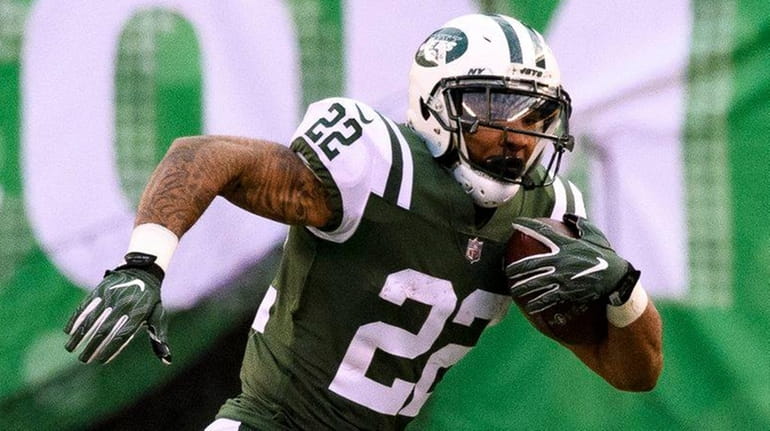 Jets running back Matt Forte tries to get past Chargers...
