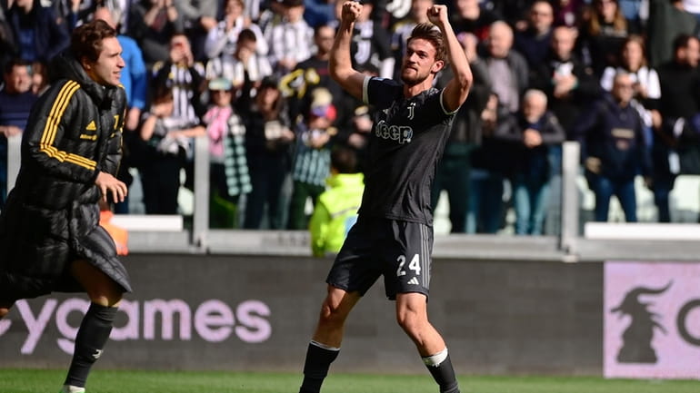 Juventus' Daniele Rugani celebrates after scoring their side's third goal...