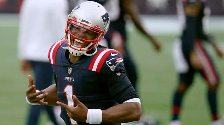 Patriots quarterback Cam Newton celebrates after defeating the Raiders on Sunday...