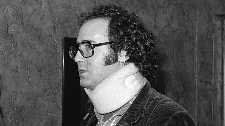 Comedian Andy Kaufman wears a neck brace in June 1982...