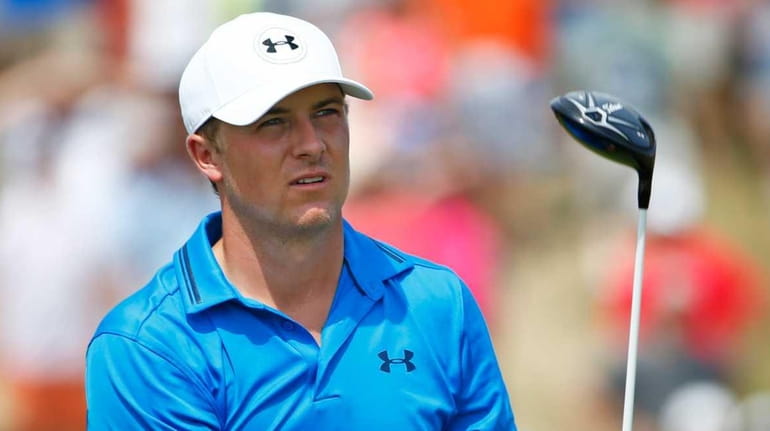 Jordan Spieth watches his tee shot on the second hole...
