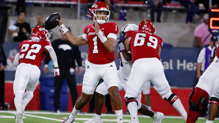 Fresno State quarterback Mikey Keene drops back to pass against...
