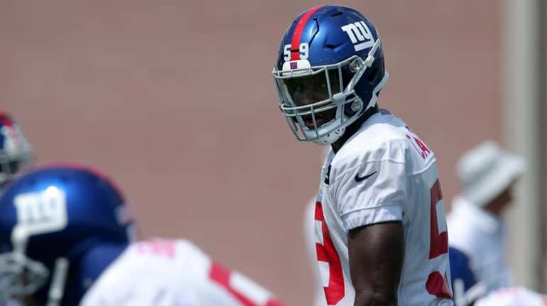 Giants linebacker Lorenzo Carter  lines up during a drill during...