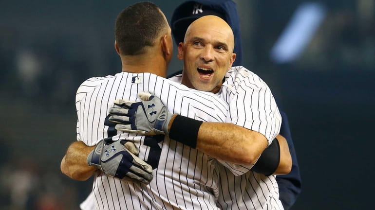 Raul Ibanez celebrates his game-winning RBI single in the 12th...