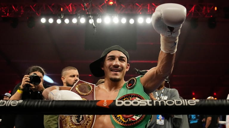 FILE- Teofimo Lopez celebrates after defeating Pedro Campa by TKO...