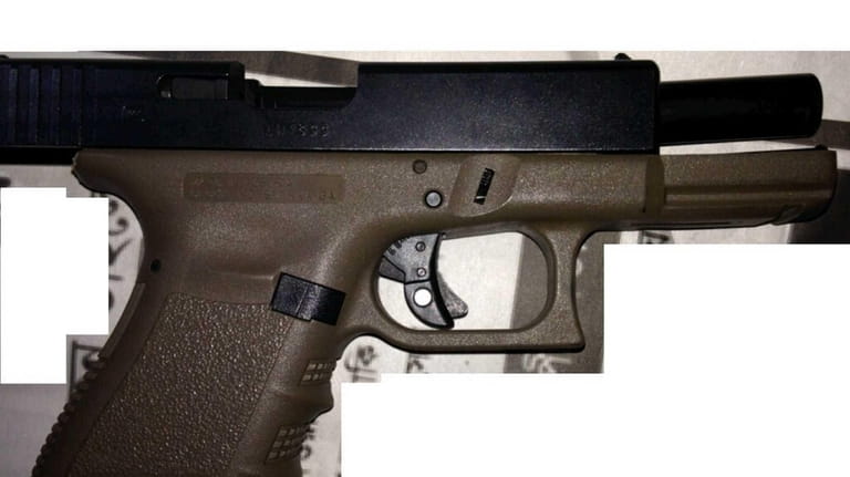The NYPD released a photo of a weapon, a 9-millimeter...