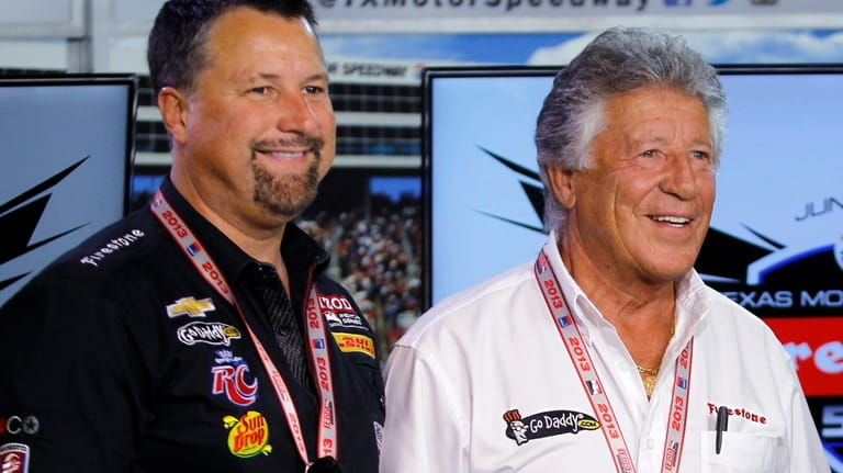 In this June 7, 2013, photo, Michael Andretti, left, and...