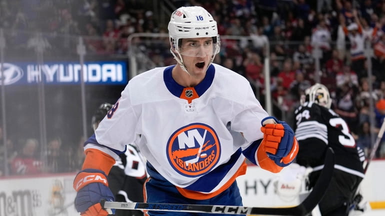 The Islanders' Pierre Engvall reacts after assisting on a goal...