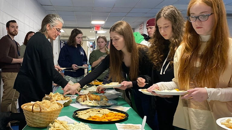 Northport High School Students enjoyed a sampling of cheeses from around...