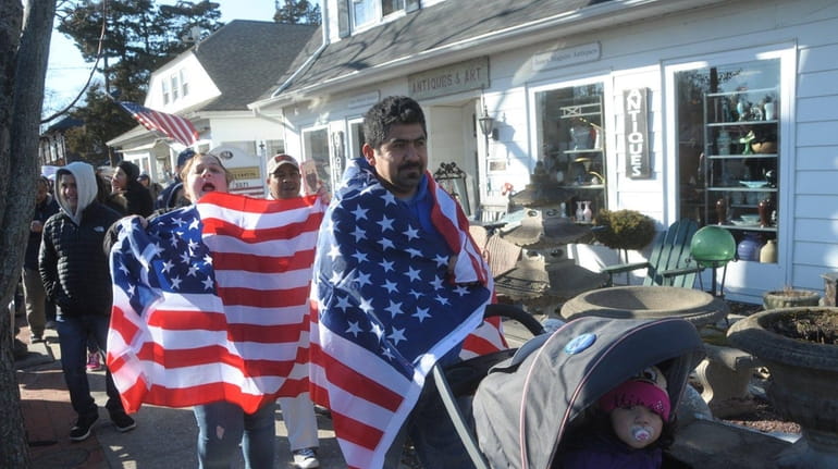 People march along Montauk Highway in Hampton Bays to the...