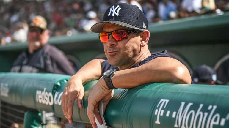 Yankees manager Aaron Boone in the dugout before a game against...