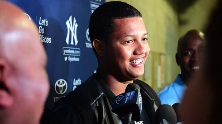 Starlin Castro speaks to the media during Spring Training at...