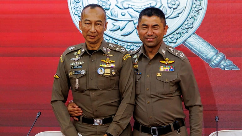 Chief Royal Thai Police Torsak Sukvimol, left, Duputy Chief the...