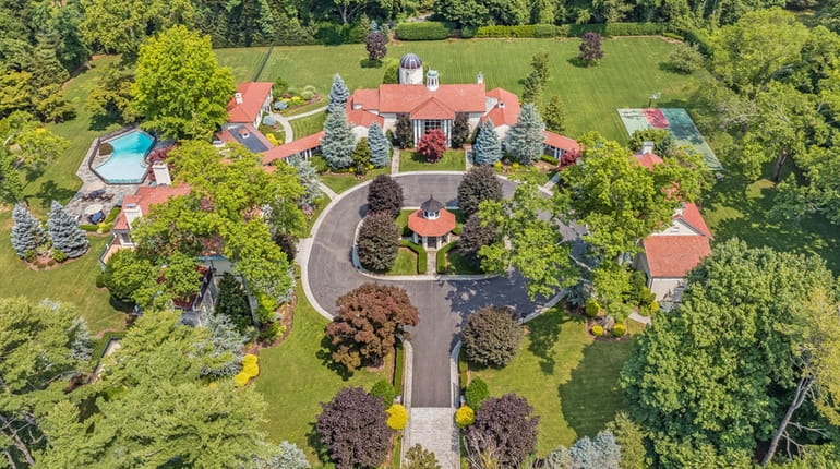 Built in 1912, the 10,000-square-foot home in Cove Neck is...