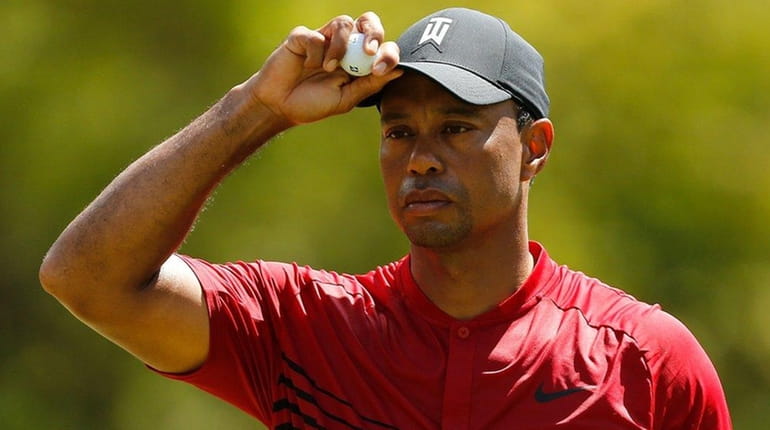 Tiger Woods reacts on the second green during the final...