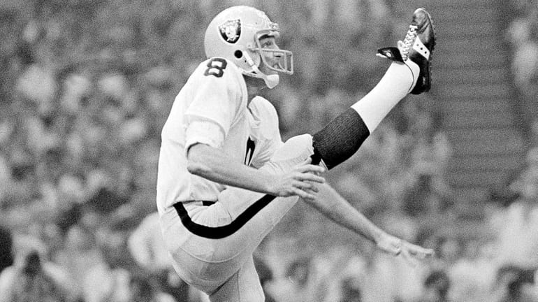 Raiders punter Ray Guy kicks during the Super Bowl at...