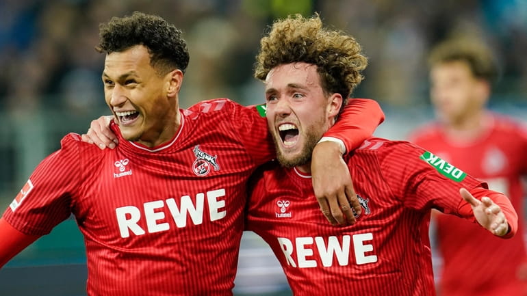 Cologne's Davie Selke, left, and Cologne goalscorer Luca Waldschmidt celebrate...