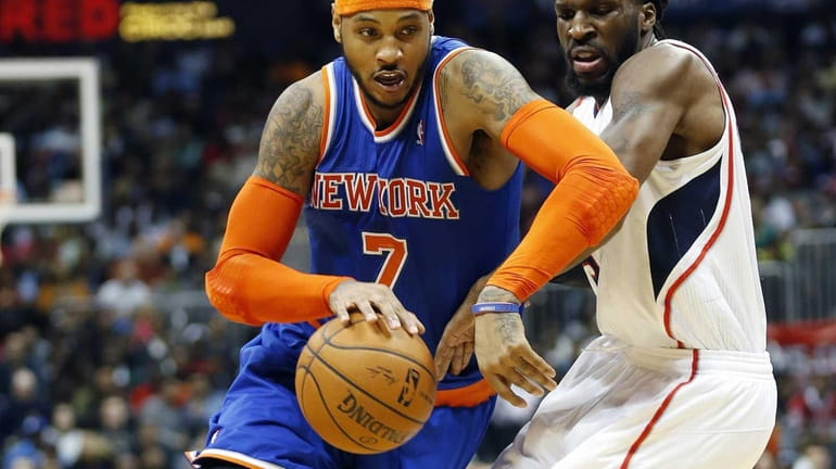 Knicks forward Carmelo Anthony drives against Atlanta Hawks forward DeMarre...