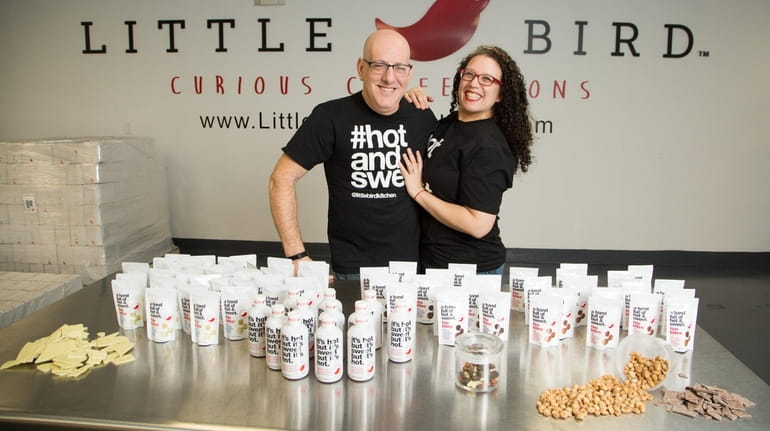 Sara and Corey Meyer, owners of Little Bird Kitchen, display...