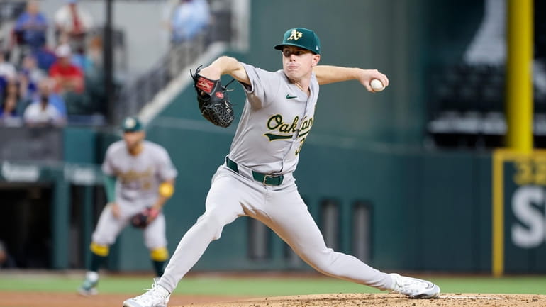 Oakland Athletics pitcher JP Sears throws against the Texas Rangers...