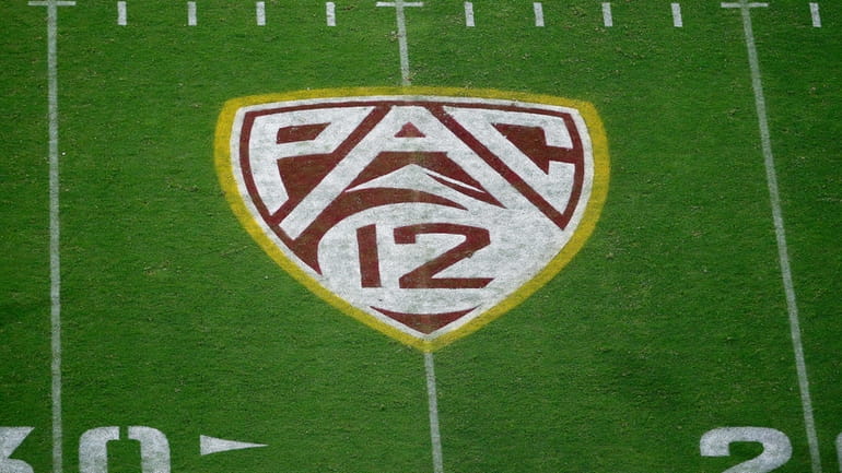 The field at Sun Devil Stadium bears a Pac-12 logo...