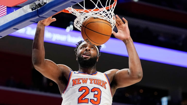 Knicks center Mitchell Robinson dunks during the second half of...