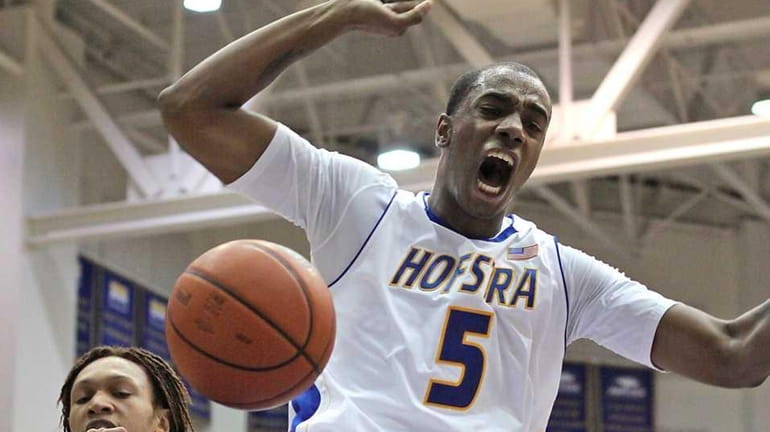 Hofstra's David Imes lets out a shout after big slam...