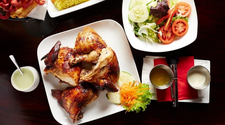 Juicy, Peruvian-style rotisserie chicken feeds at least two and comes...
