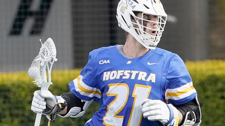 Hofstra's Dylan McIntosh (21) brings the ball around the goal...