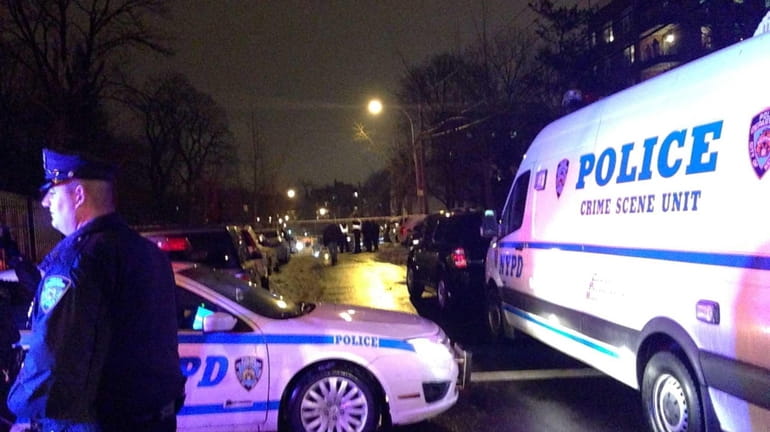 NYPD vehicles block off the area in which a Nassau...