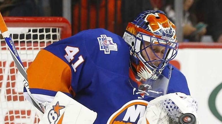 Jaroslav Halak #41 of the New York Islanders makes a...