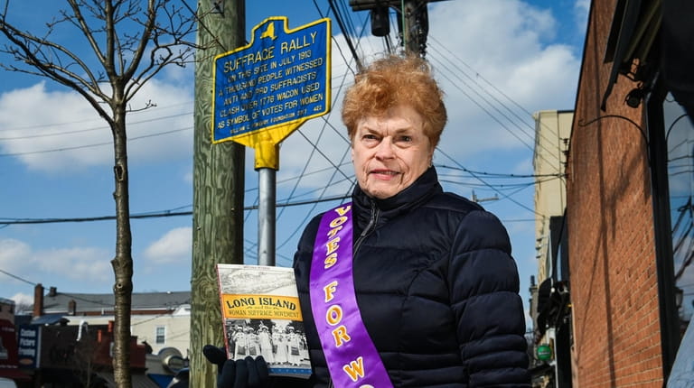 Antonia Petrash, of Glen Cove, holds her book, "Long Island...
