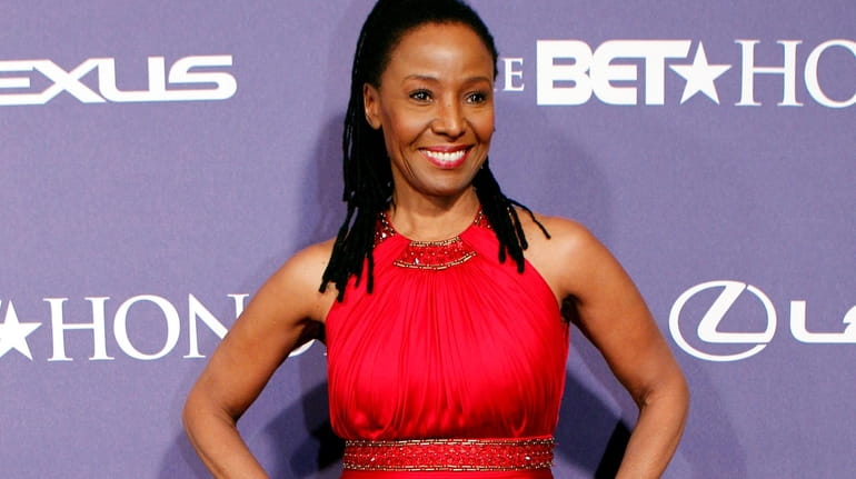 B. Smith arrives at the BET Honors red carpet in...