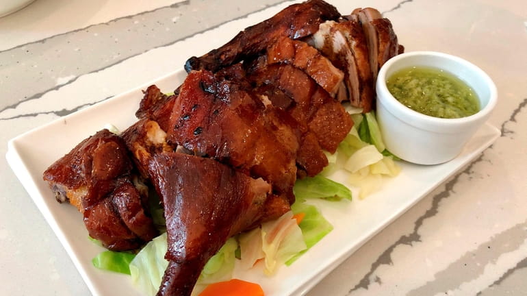 Long Island Pekin in Babylon specializes in Chinese roast duck,...