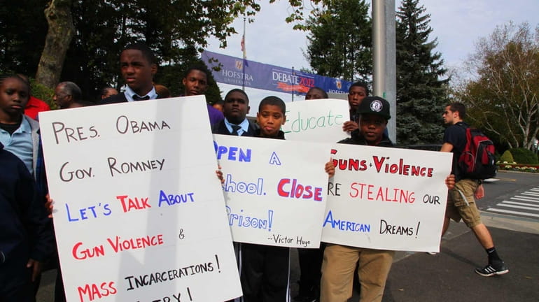 Young students rally outside Hofstra University the day before the...