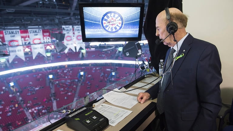Broadcaster Bob Cole looks out over the ice prior to...