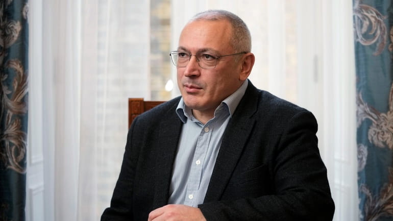 Exiled Russian businessman and opposition figure Mikhail Khodorkovsky poses during...