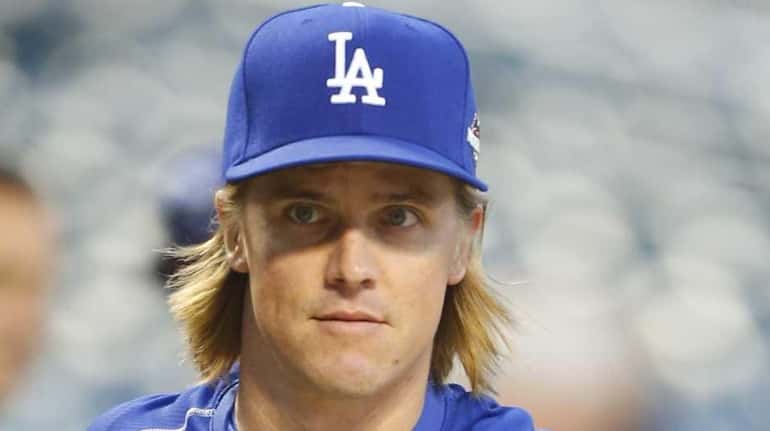Los Angeles Dodgers starting pitcher Zack Greinke during warmups as...