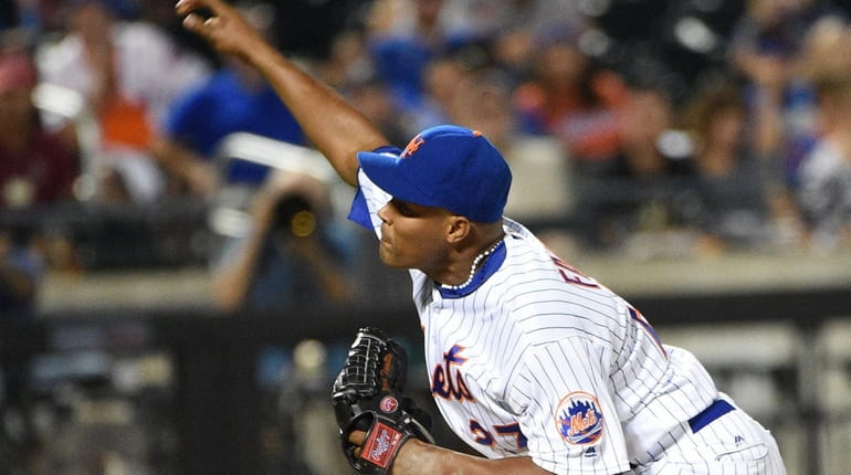 New York Mets relief pitcher Jeurys Familia delivers a pitch...