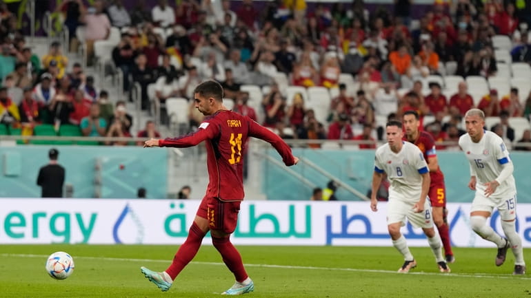 Spain's Ferran Torres scores a penalty, the third goal of...