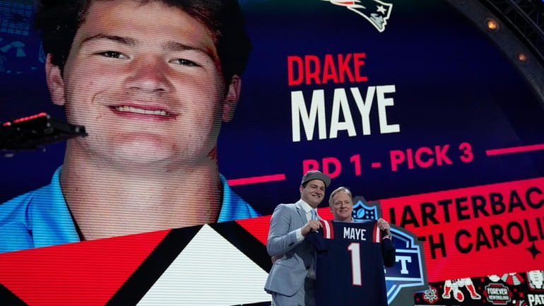 North Carolina quarterback Drake Maye poses with NFL commissioner Roger...