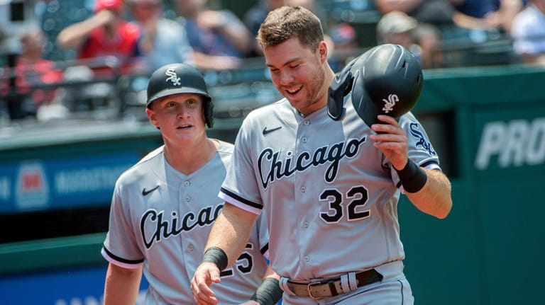 Chicago White Sox' Gavin Sheets, foreground, and Andrew Vaughn, rear,...